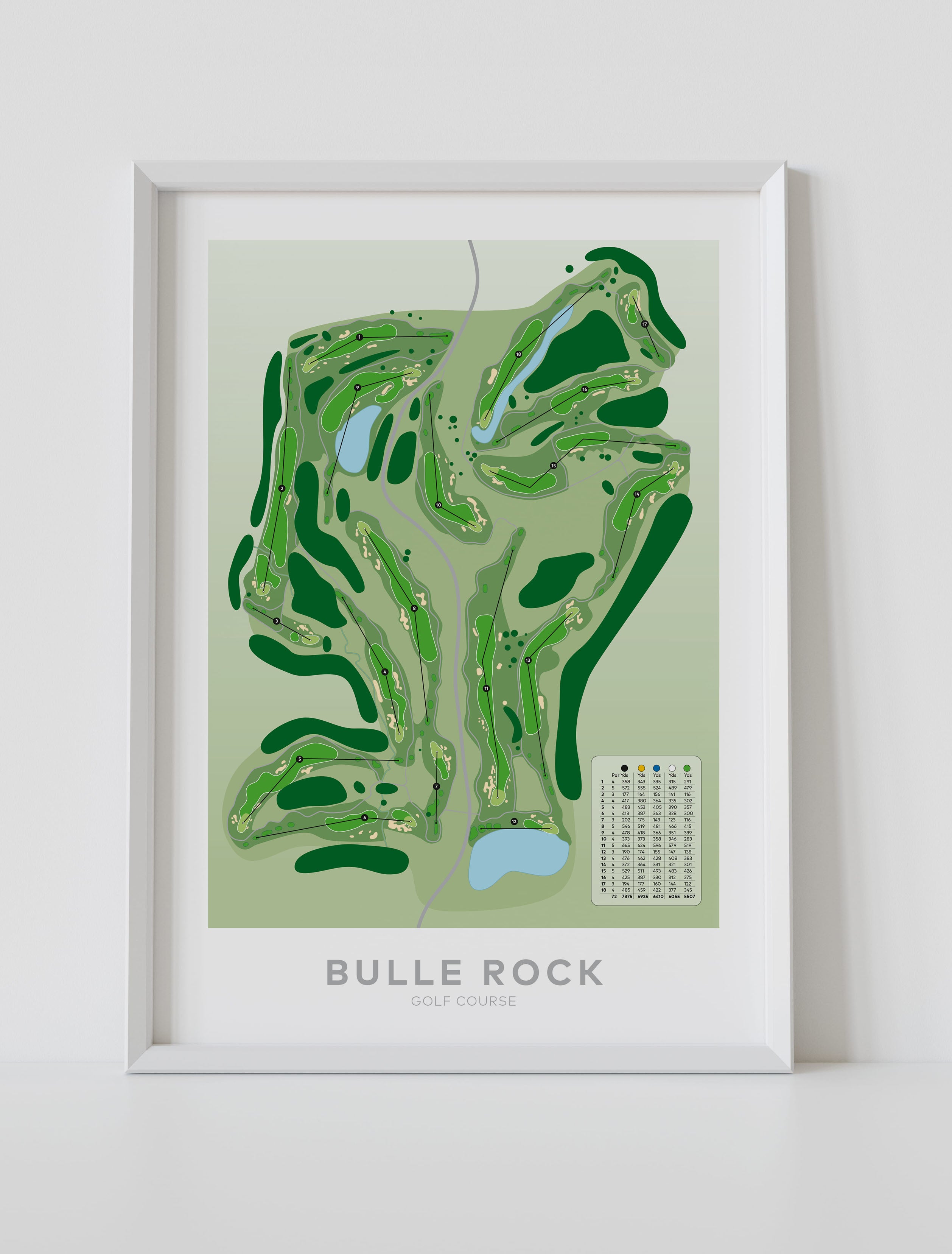 A framed golf course map print for Bulle Rock Golf Course, featuring a green and light green illustrated layout with blue water features and a small legend, displayed against a light gray wall.